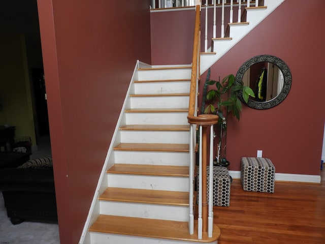 stairway featuring hardwood / wood-style flooring