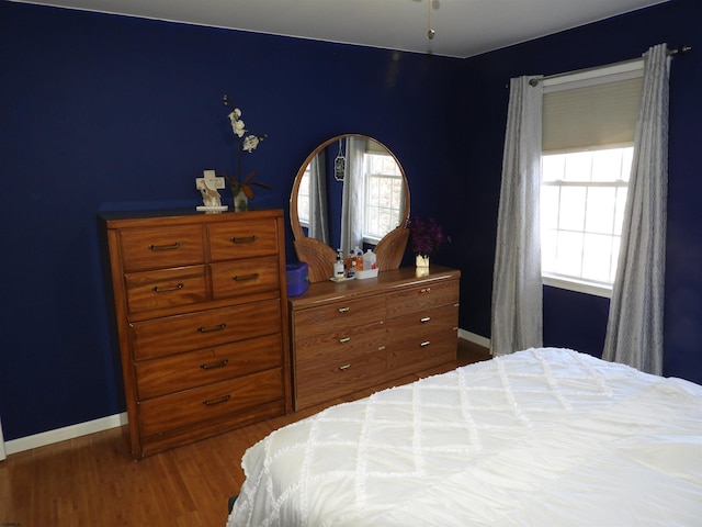 bedroom featuring wood-type flooring