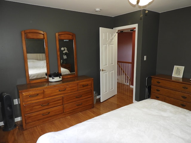 bedroom with hardwood / wood-style floors