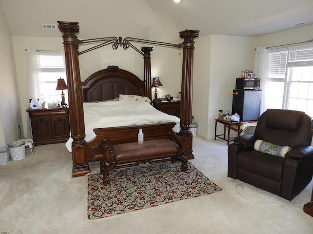 bedroom featuring light carpet