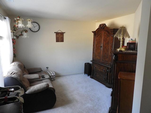 living area with light colored carpet