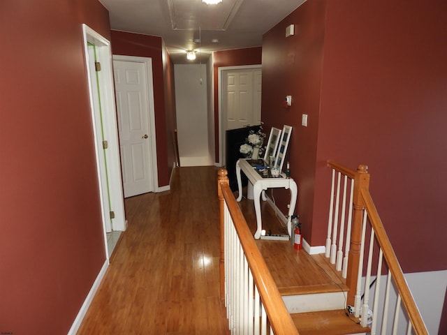 corridor featuring wood-type flooring