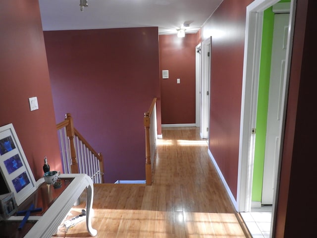 corridor with light wood-type flooring