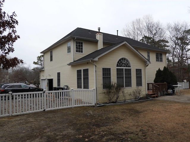 back of house with a garage