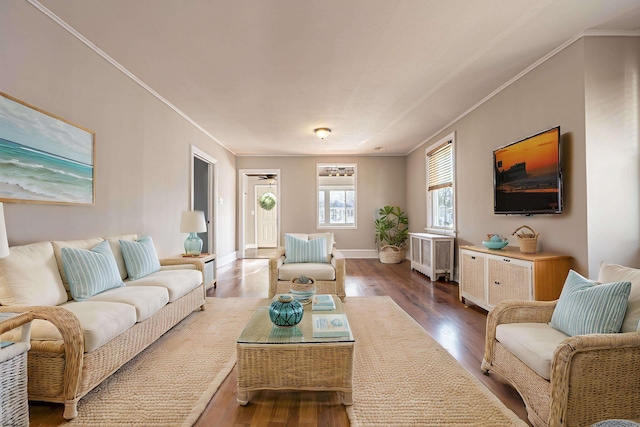 living room with hardwood / wood-style flooring and ornamental molding