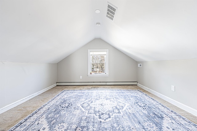 bonus room featuring vaulted ceiling, a baseboard heating unit, and light carpet