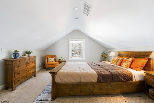 carpeted bedroom featuring lofted ceiling