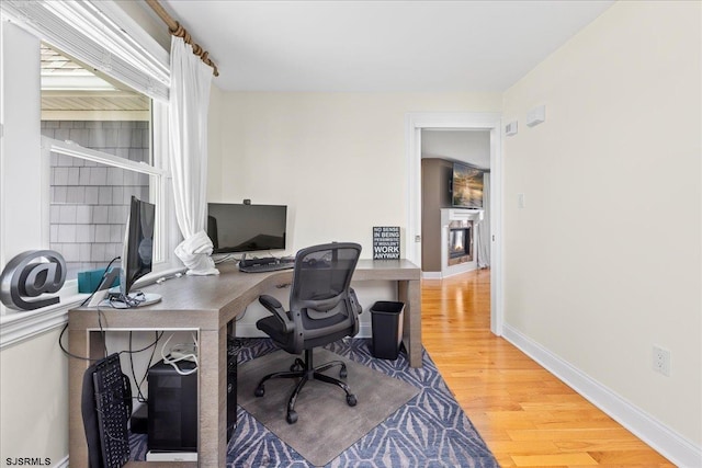 office area with hardwood / wood-style floors