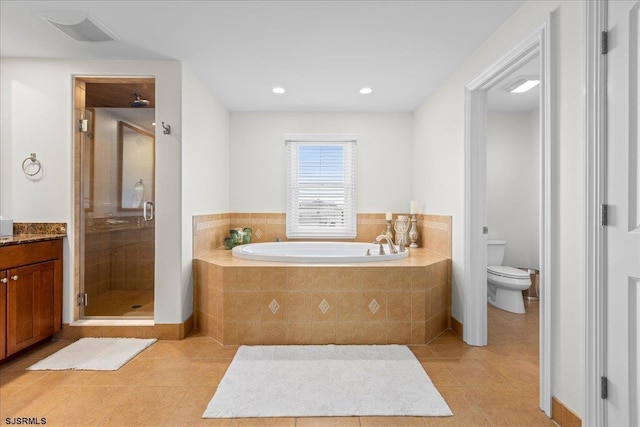 full bathroom with tile patterned flooring, vanity, shower with separate bathtub, and toilet