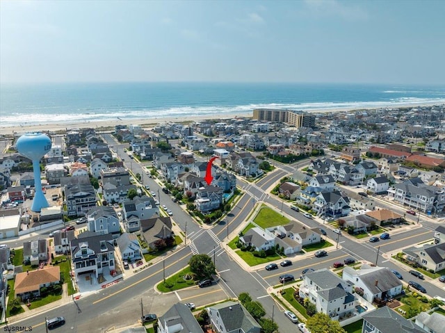 aerial view featuring a water view and a beach view