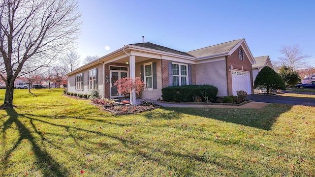 view of front of property featuring a garage and a front lawn