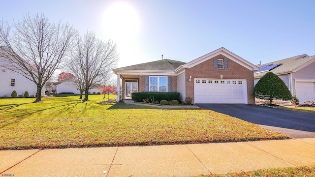 view of front of property featuring a garage and a front yard