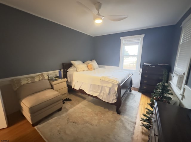 bedroom featuring hardwood / wood-style flooring and ceiling fan