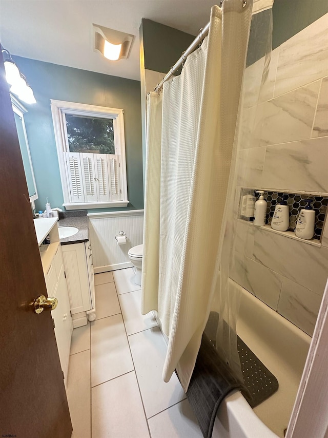 bathroom with vanity, tile patterned flooring, and toilet