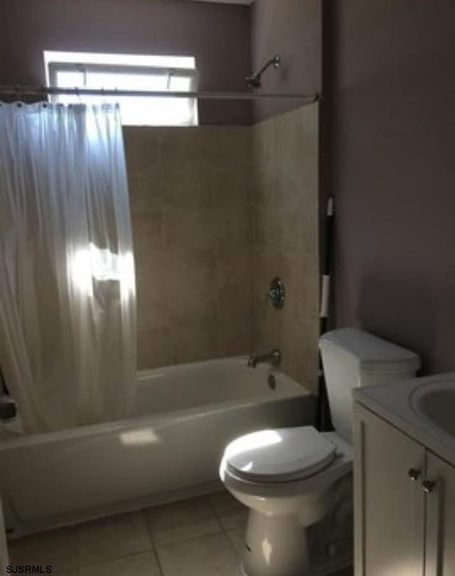 full bathroom with vanity, tile patterned floors, toilet, and shower / bath combo