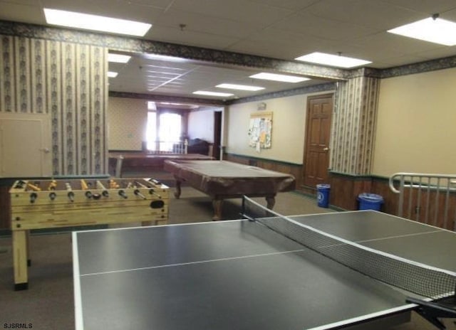 rec room featuring pool table, wood walls, a drop ceiling, and wainscoting