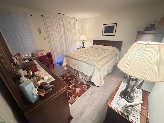 bedroom with wood finished floors