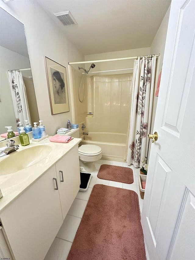 full bath with shower / bath combo, vanity, visible vents, and tile patterned floors