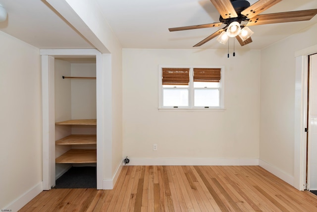 unfurnished bedroom with ceiling fan and light hardwood / wood-style flooring