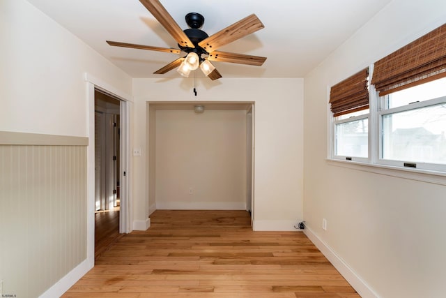 interior space with ceiling fan and light hardwood / wood-style flooring