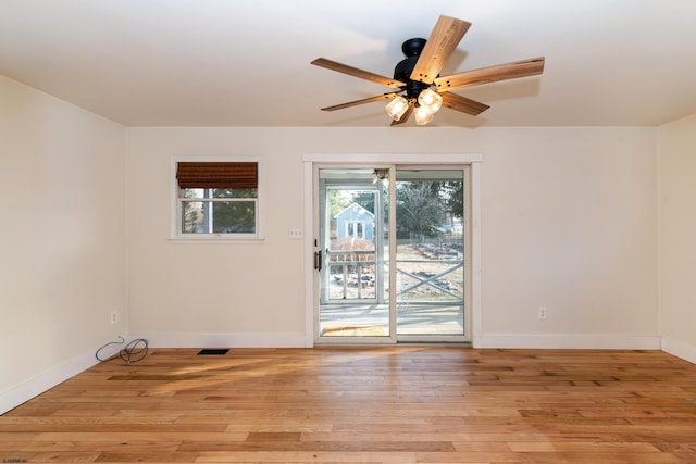 unfurnished room with light hardwood / wood-style flooring and ceiling fan