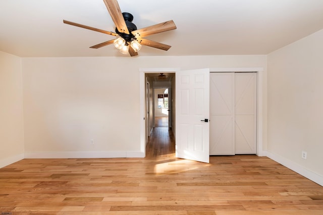 unfurnished bedroom with a closet, ceiling fan, and light wood-type flooring