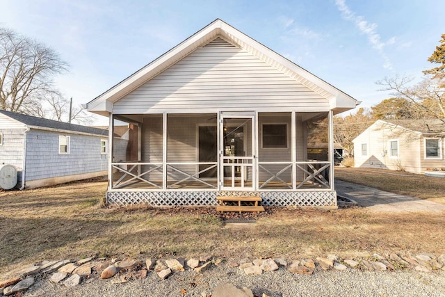 rear view of house with a sunroom