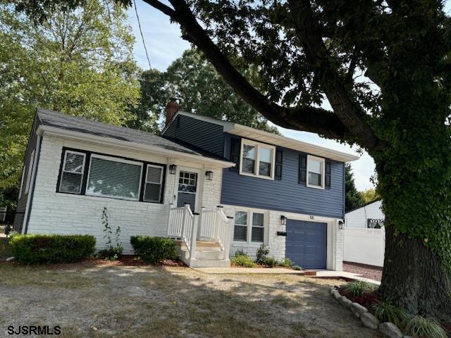 split level home featuring a garage