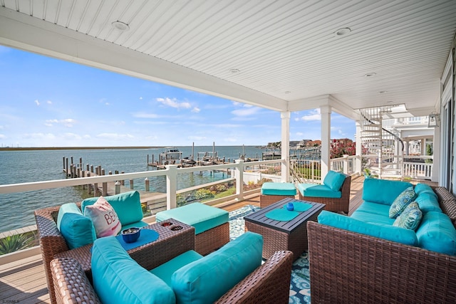 exterior space featuring a water view and outdoor lounge area