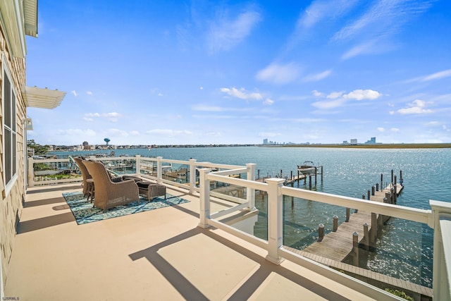 dock area with a water view