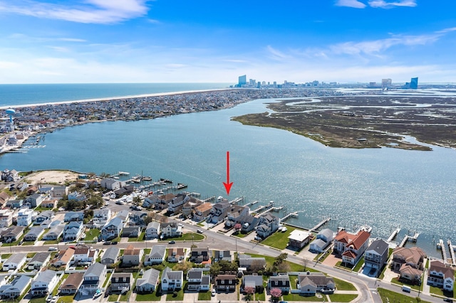 birds eye view of property featuring a water view