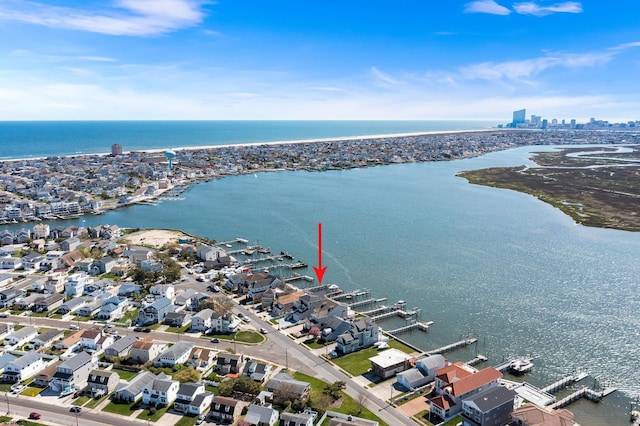 birds eye view of property featuring a water view