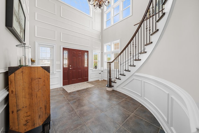 entryway featuring a chandelier