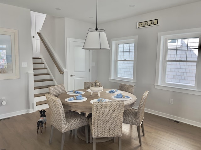 dining space featuring dark hardwood / wood-style floors