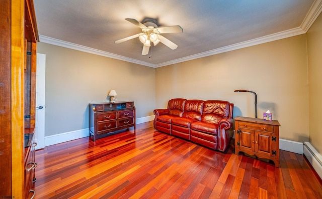 living room featuring hardwood / wood-style flooring, crown molding, a baseboard heating unit, and ceiling fan