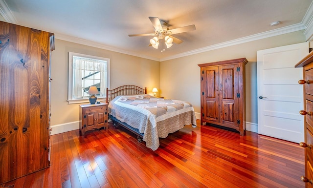 bedroom with crown molding, ceiling fan, and dark hardwood / wood-style flooring