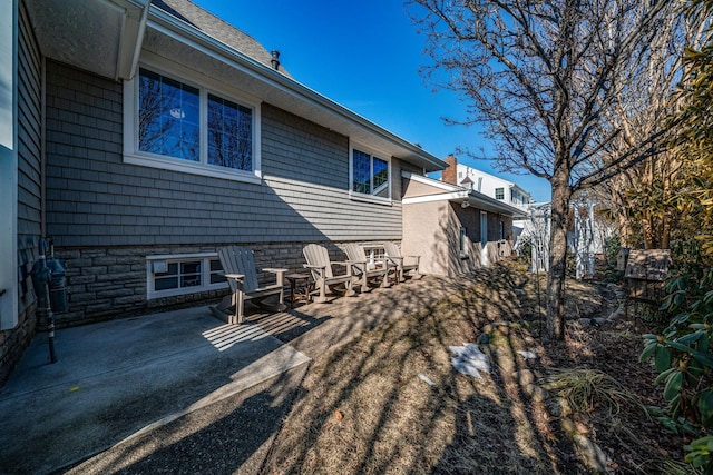 rear view of property with a patio area