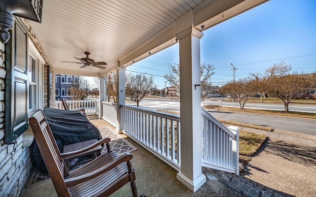 view of patio / terrace with ceiling fan and a porch