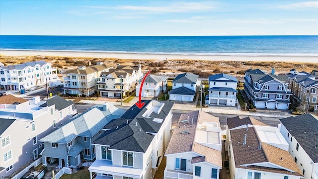 aerial view featuring a water view and a beach view