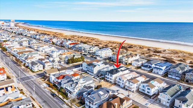 aerial view featuring a water view and a beach view