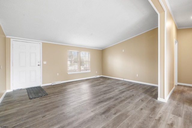 unfurnished living room with ornamental molding and light hardwood / wood-style floors