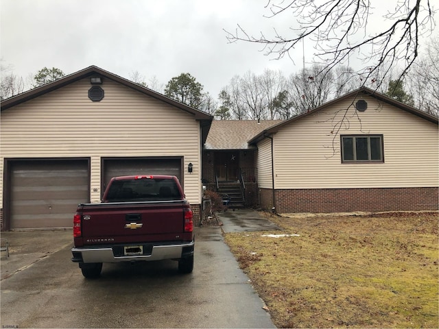 single story home featuring a garage