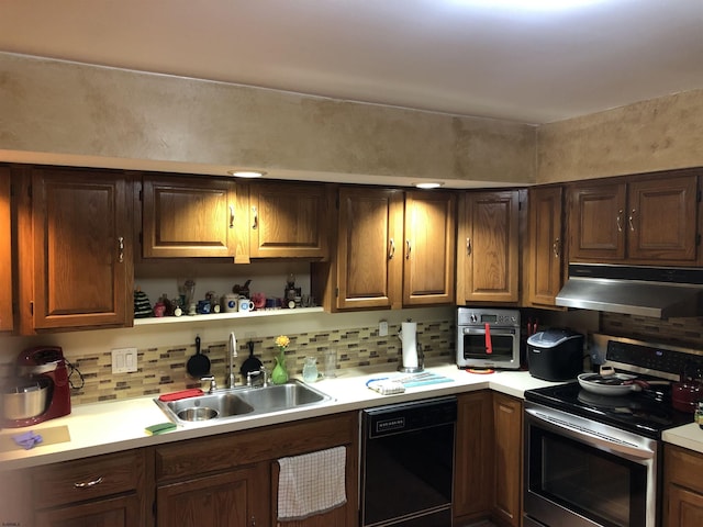 kitchen featuring sink, backsplash, and appliances with stainless steel finishes