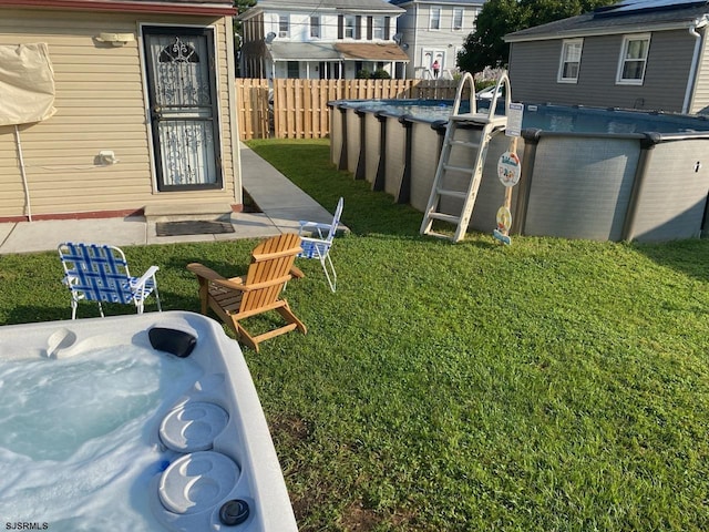 view of yard with a fenced in pool