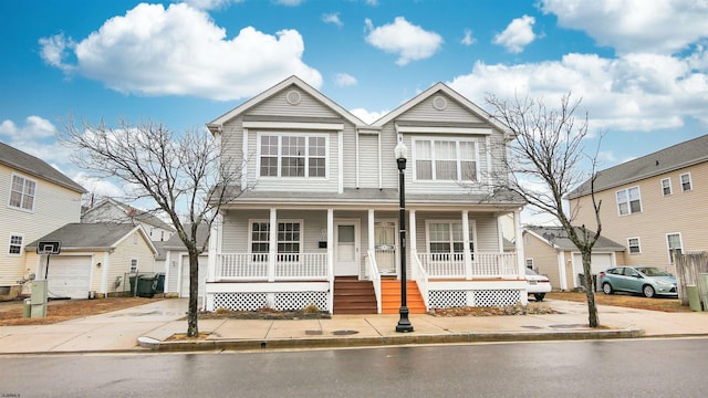 view of front facade with a porch and a garage