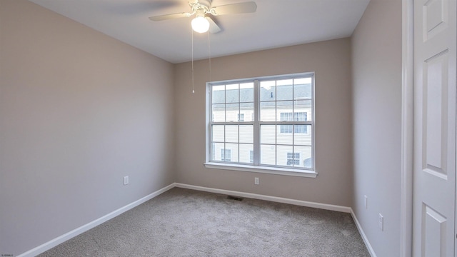 carpeted empty room with ceiling fan