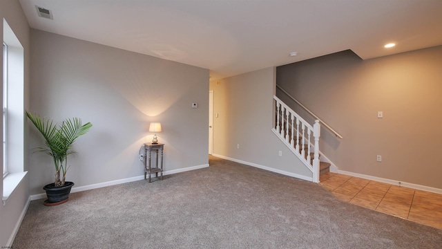 spare room featuring carpet floors