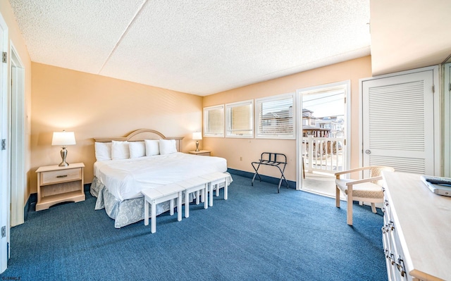 carpeted bedroom with a textured ceiling