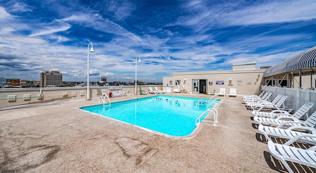 view of swimming pool with a patio area