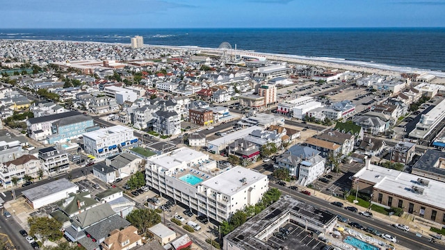 birds eye view of property featuring a view of the beach and a water view